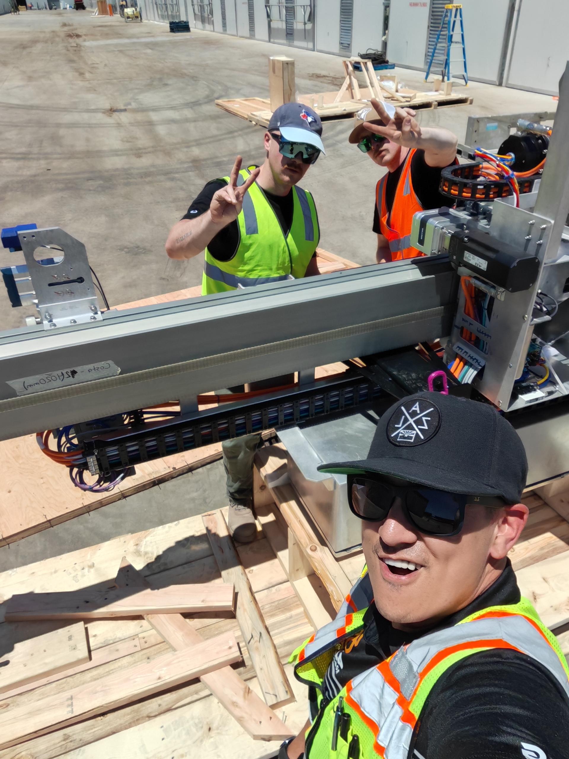 4AG team installing robots onto farms